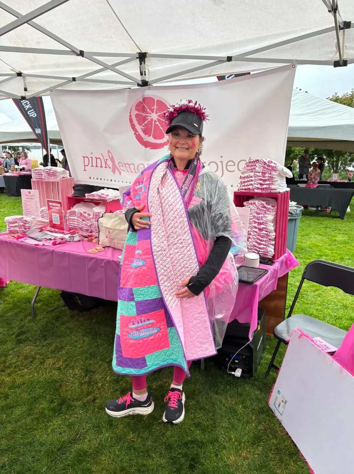 A Pink Lemonade Project outreach booth staffed by volunteers
