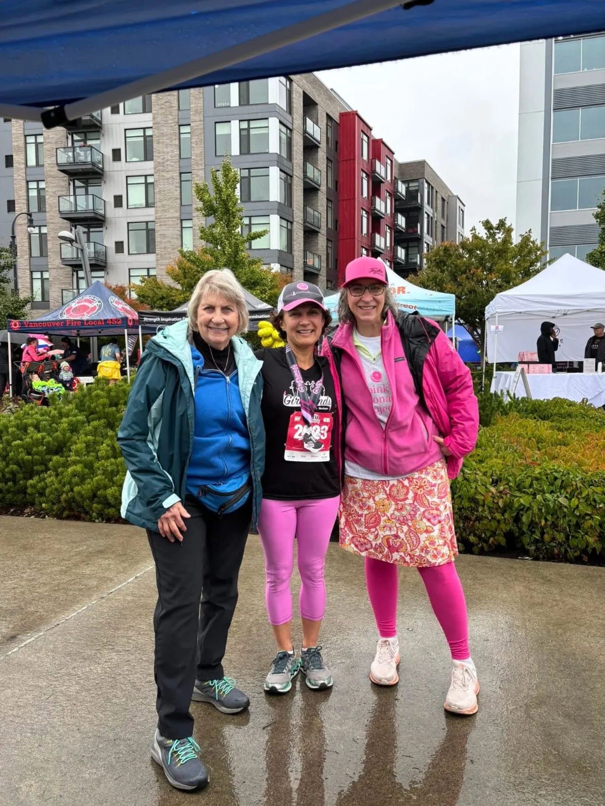 Two Pink Lemonade Project volunteers at a check-in table